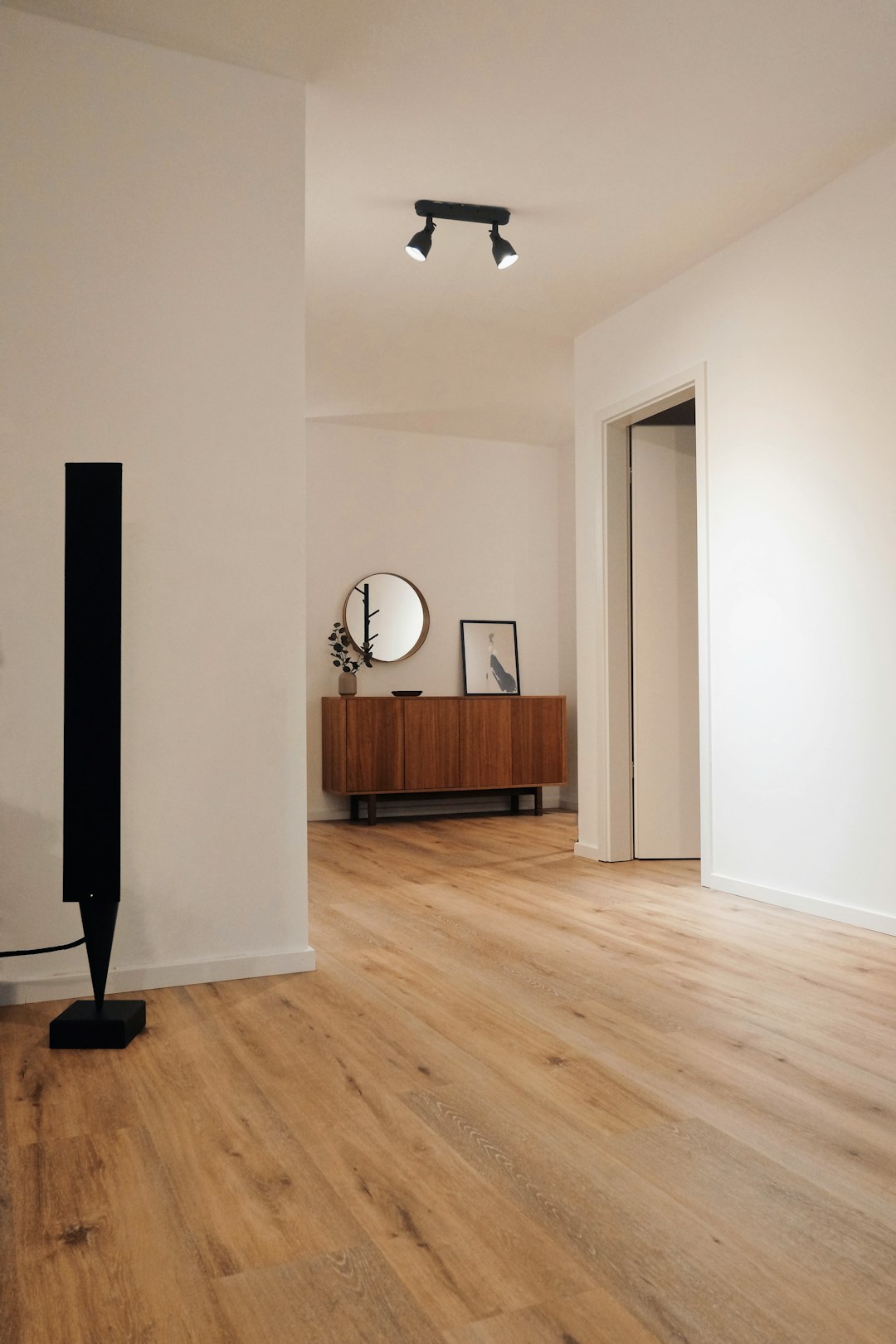 black-tower-speaker-beside-white-wall-61tfynirwmi
